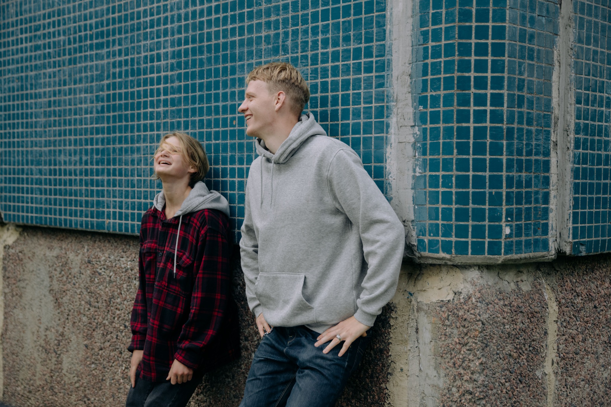 Two teenagers talking and laughing together